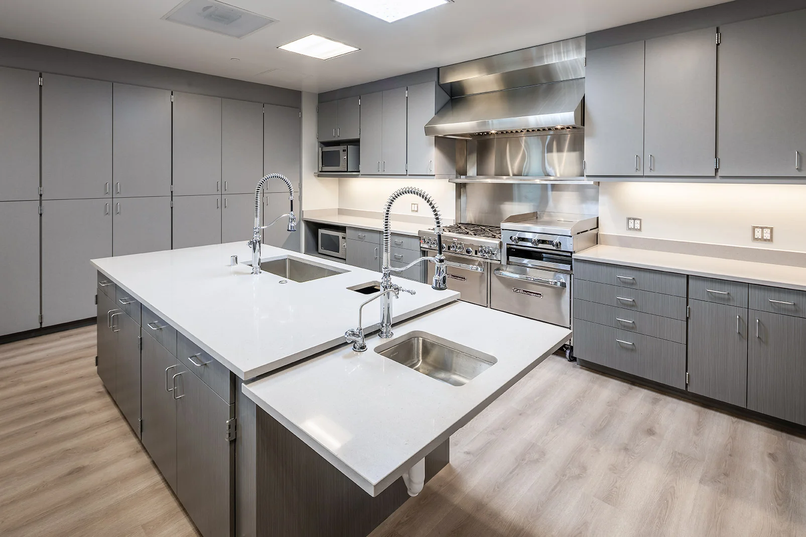 Commercial casework and white solid-surface counters inside Fire Station 10
