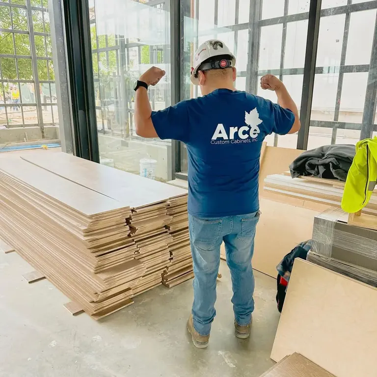 Arce installer working with wood cladding on a commercial project